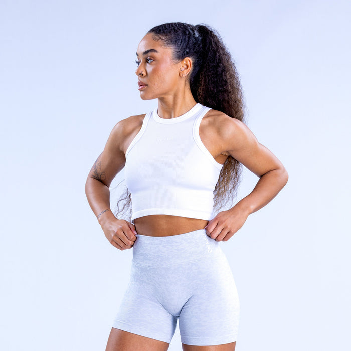White racerback crop tank top, sleeveless athletic fit with banded hem