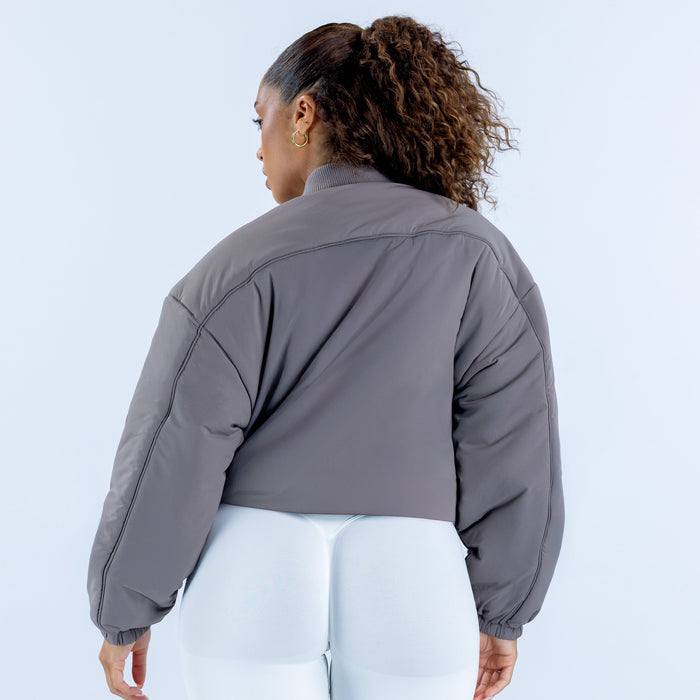 Reversible bomber jacket back view in dark gray with full-length sleeves