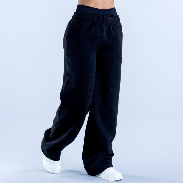 Wide-leg jogger pants in dark navy with gathered elastic waistband and roomy legs