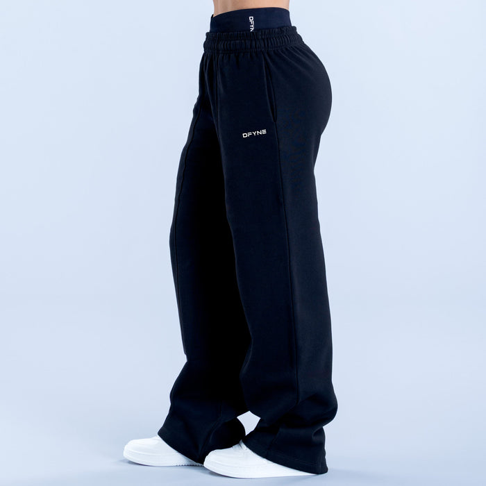 Wide-leg jogger pants in dark navy with side seam detail and small DYFNS logo