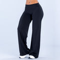 Wide-leg pants, dark black, high-rise fitted waistband, flowing wide legs.