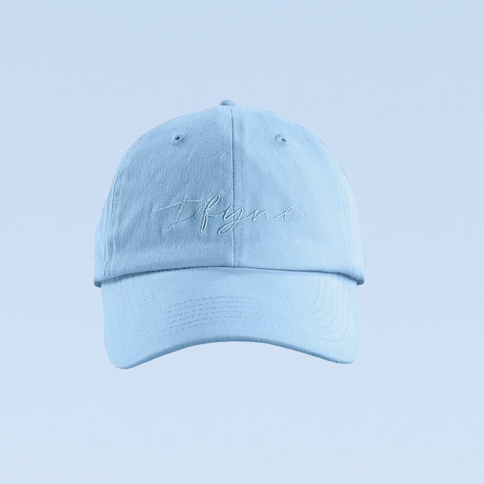 Light blue baseball cap with script logo front panel and curved brim