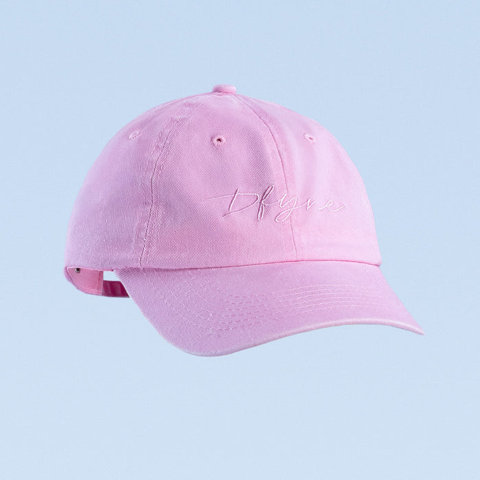 Pink script baseball cap with embroidered cursive logo on front
