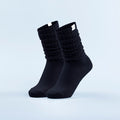 Black scrunch ankle socks with gathered ribbed cuffs and seamless toe.