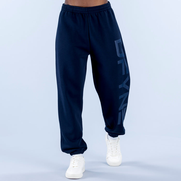 Navy cuffed jogger pants with elastic waistband and side graphic print