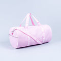 Light pink duffle bag with zip top, side zipper pocket, and logo strap handles.