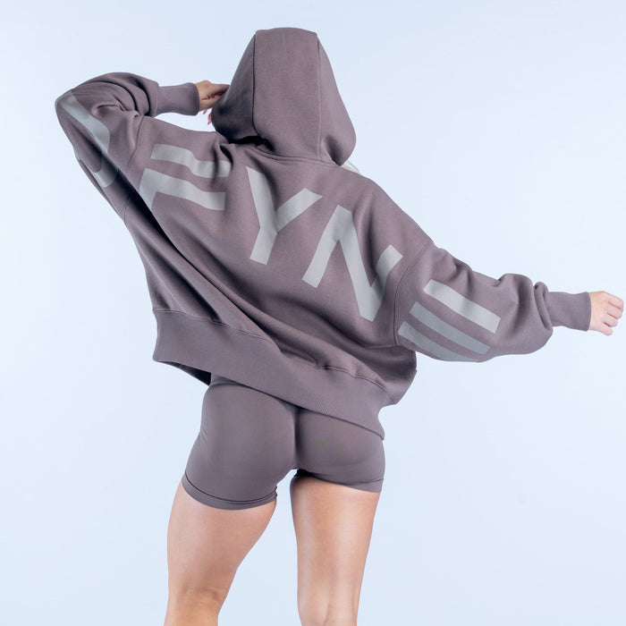 Taupe hoodie with large white graphic letters on back, drawstring hood