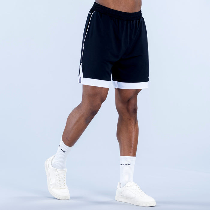 Dark jersey shorts with elastic waist and white-trim hem; knee-length fit