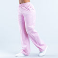 Pink track pants with elastic waistband and side seams, small logo on thigh