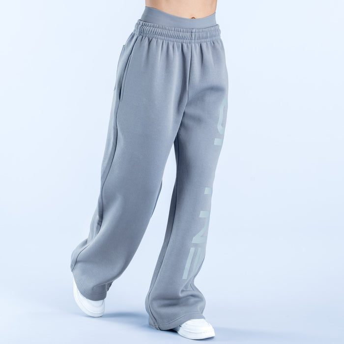 Light gray wide-leg jogger pants with side graphic logo and relaxed cuffed hems