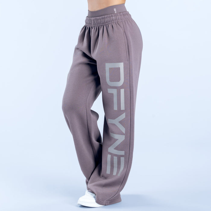 Taupe wide-leg joggers with elastic waist and large 'DENY' side graphic