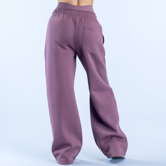 Purple wide-leg jogger pants with elastic waistband and relaxed back fit