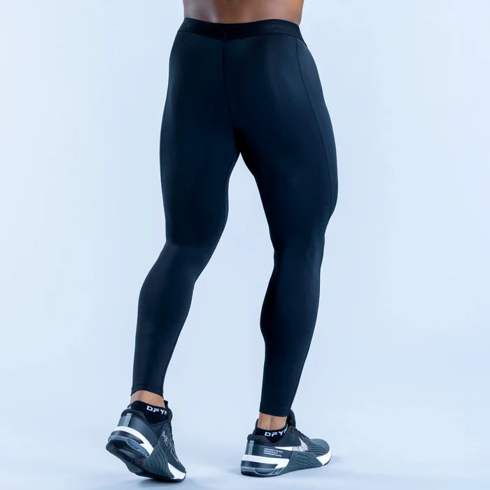 Black full-length compression base layer leggings, rear view with contoured seam lines