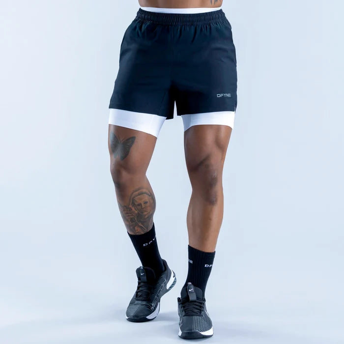 Black compression base-layer shorts with white hem band and elastic waistband