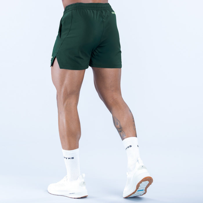 Green training shorts with back patch pocket and small logo on side