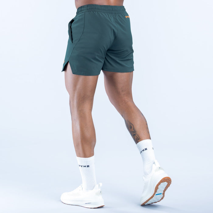 Men's teal training shorts with cargo-style side pocket, elastic waistband