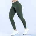 Dark green high-waist leggings with small side logo and ankle length