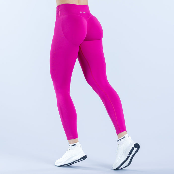 Vision leggings fuchsia, tapered legs and back seam detail.