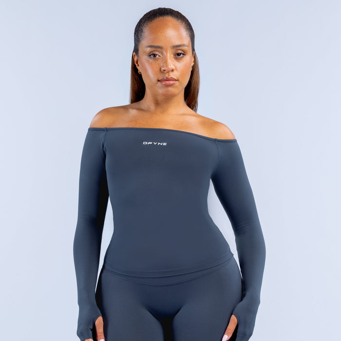 Navy long-sleeve off-shoulder performance top with fitted stretch silhouette