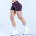 4.5-inch performance shorts, dark purple; side view with smooth stretch panels