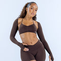 Dark brown long-sleeve shrug over sports bra, cropped fit