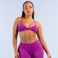 Purple twist-front sports bra with V-neck and racerback straps